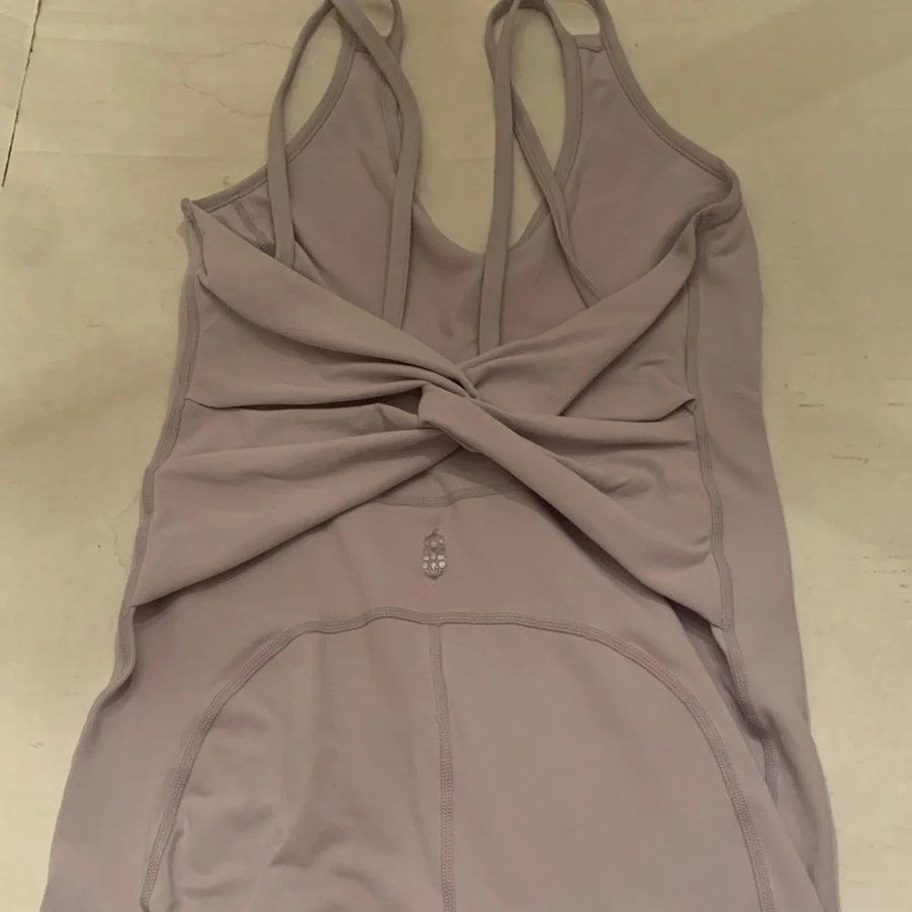 FP Movement by Free People Twist back Onesie size Small
mauve color - Picture 1 of 8